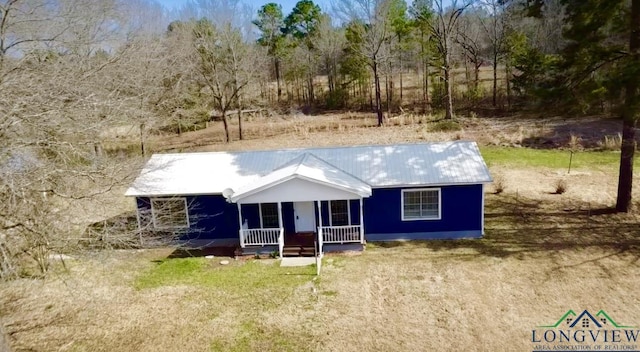 587 Floyd Evans Rd, Marshall, TX 75672 - view of front facade with a porch and metal roof