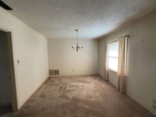 unfurnished dining area featuring carpet flooring, a textured ceiling, and a notable chandelier