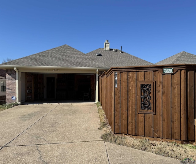 view of side of home with a garage