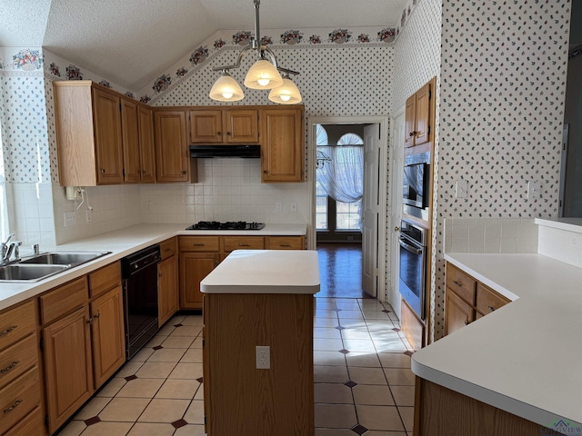 kitchen with lofted ceiling, sink, a kitchen island, pendant lighting, and black appliances