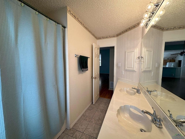 bathroom with vanity, a shower with curtain, tile patterned floors, and a textured ceiling