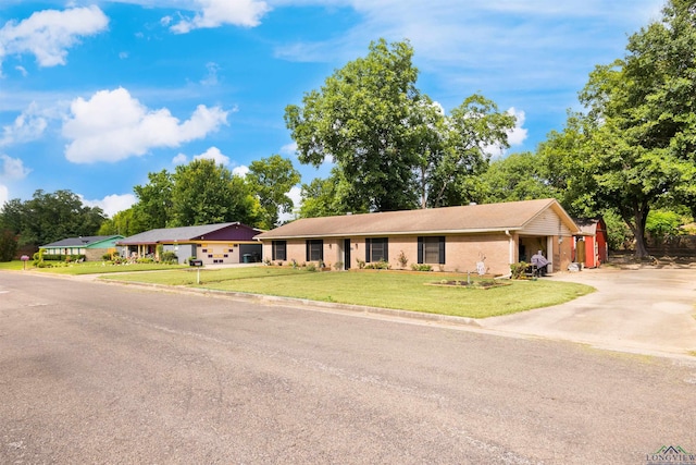 1115 Fuller Dr, Longview, TX 75602 - single story home with driveway, a front yard, and brick siding