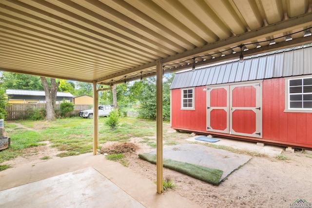 1115 Fuller Dr, Longview, TX 75602 - view of patio / terrace featuring a storage unit