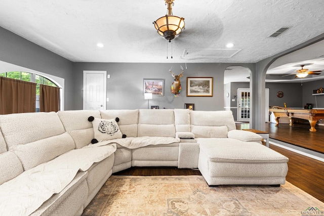 living area with a ceiling fan, visible vents, billiards, and wood finished floors