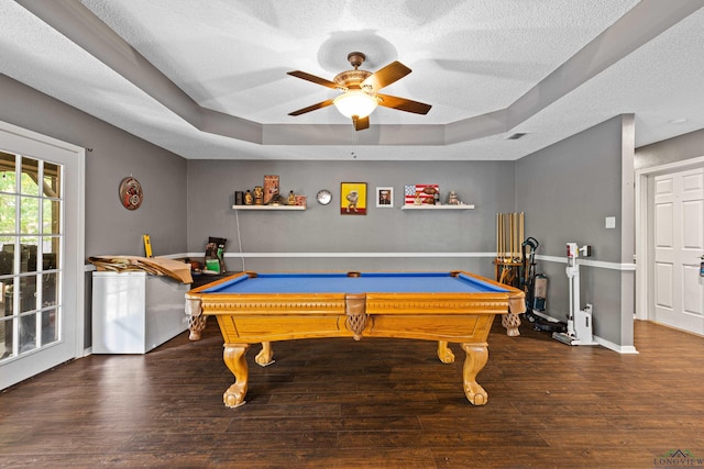 rec room with billiards, a ceiling fan, a textured ceiling, wood finished floors, and a raised ceiling