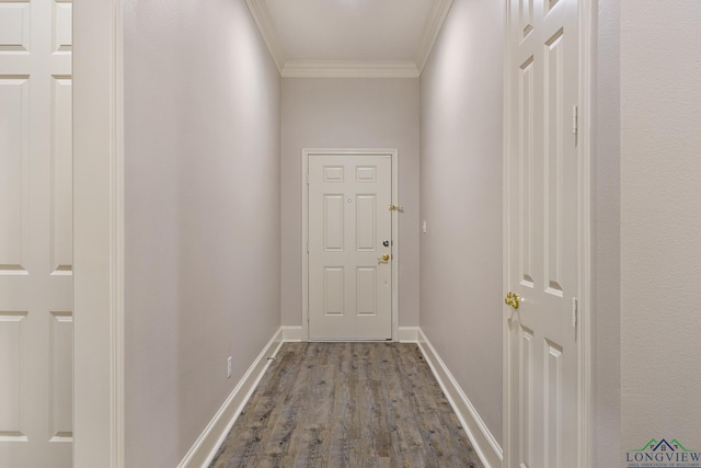 doorway to outside featuring hardwood / wood-style flooring and crown molding