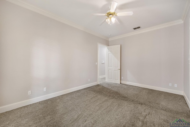 carpeted spare room with ceiling fan and crown molding