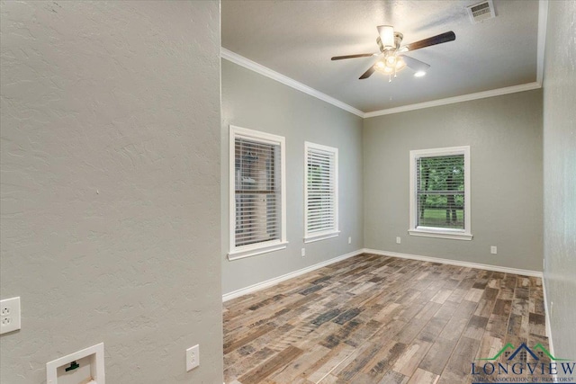 5796 Hwy 271 S, Pittsburg, TX 75686 - spare room with a ceiling fan, wood finished floors, a textured wall, ornamental molding, and baseboards