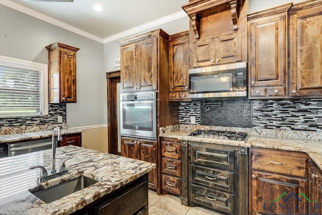5796 Hwy 271 S, Pittsburg, TX 75686 - kitchen featuring stainless steel appliances, a sink, backsplash, light stone countertops, and ornamental molding