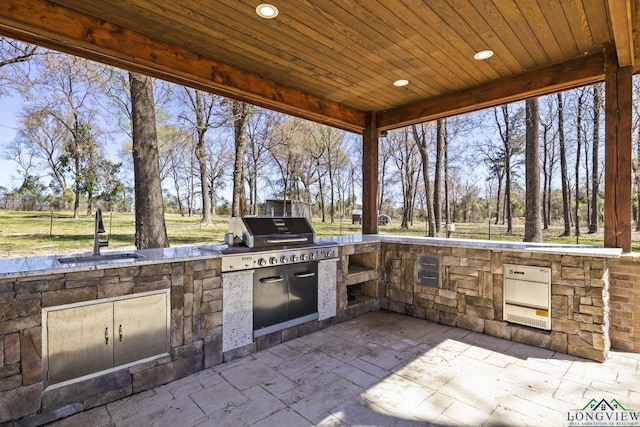 5796 Hwy 271 S, Pittsburg, TX 75686 - view of patio / terrace with a sink and view of wooded area