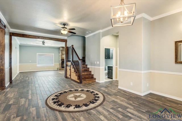 5796 Hwy 271 S, Pittsburg, TX 75686 - foyer entrance featuring wood finished floors, stairs, ceiling fan, a chandelier, and crown molding