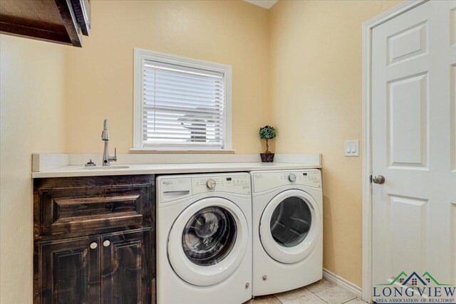 5796 Hwy 271 S, Pittsburg, TX 75686 - washroom featuring separate washer and dryer, light tile patterned floors, and baseboards