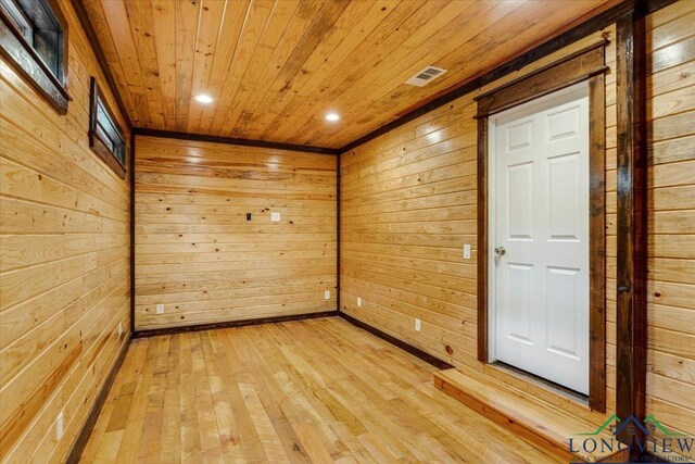 5796 Hwy 271 S, Pittsburg, TX 75686 - empty room featuring wood ceiling, wood walls, light wood-type flooring, and recessed lighting