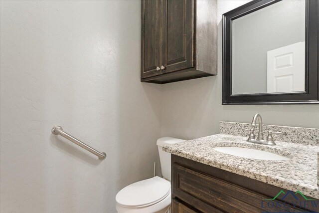 5796 Hwy 271 S, Pittsburg, TX 75686 - bathroom featuring vanity and toilet