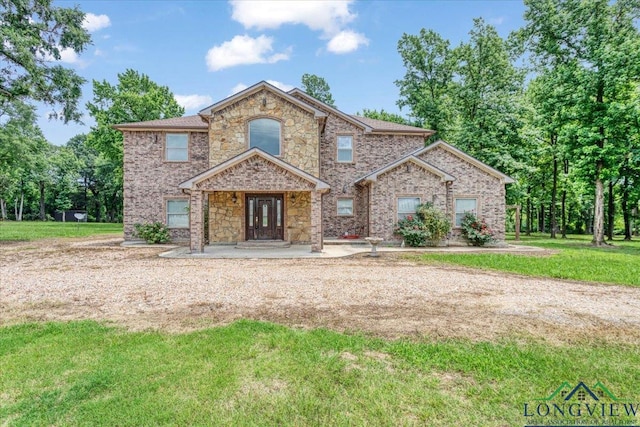 5796 Hwy 271 S, Pittsburg, TX 75686 - traditional home with a front lawn, french doors, and brick siding