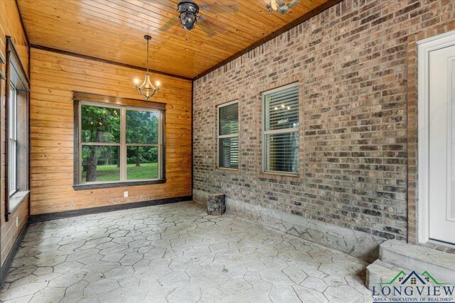 5796 Hwy 271 S, Pittsburg, TX 75686 - unfurnished sunroom featuring a chandelier