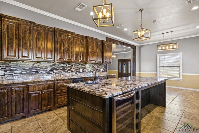 5796 Hwy 271 S, Pittsburg, TX 75686 - kitchen featuring wine cooler, light tile patterned floors, backsplash, light stone counters, and ornamental molding
