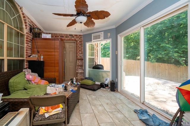 sunroom / solarium featuring ceiling fan