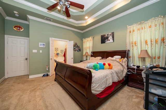 bedroom featuring a raised ceiling, ceiling fan, light carpet, and ornamental molding