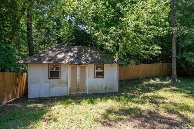 view of outbuilding featuring a yard