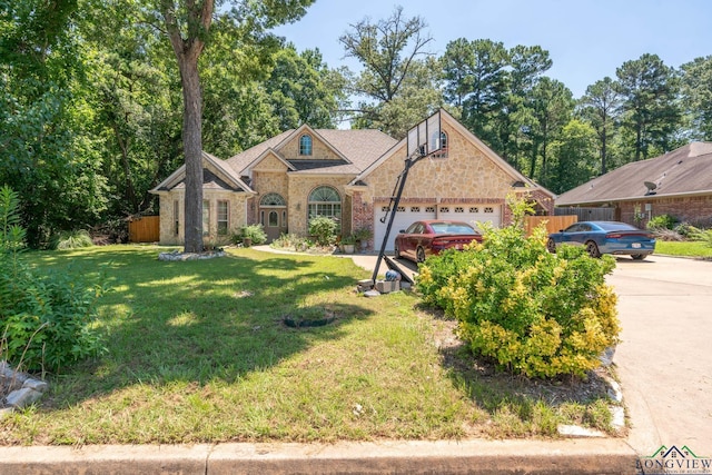 view of front facade with a front yard and a garage