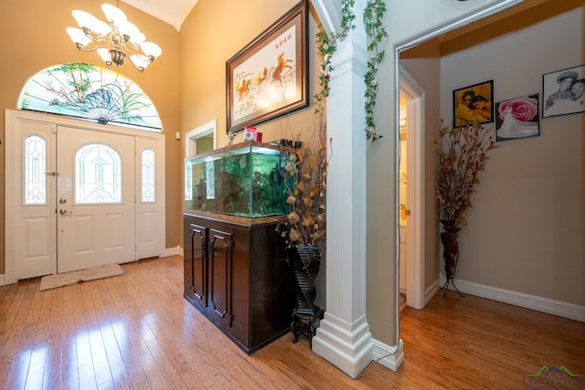 entrance foyer featuring a chandelier and light hardwood / wood-style floors