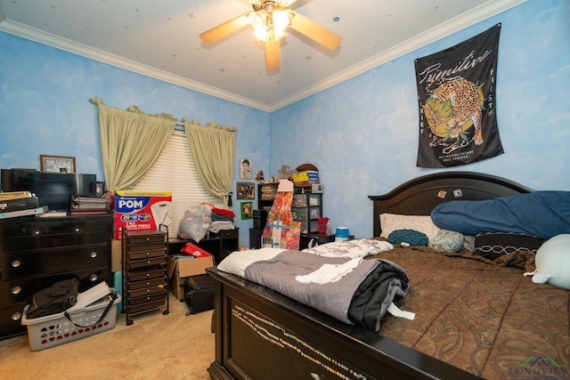 carpeted bedroom with ceiling fan and crown molding