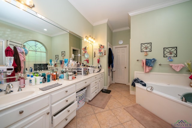 bathroom featuring a washtub, vanity, tile patterned floors, and crown molding