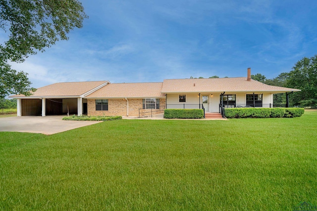 ranch-style home with covered porch and a front lawn