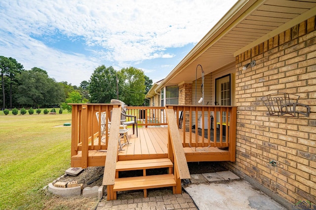 wooden terrace with a yard