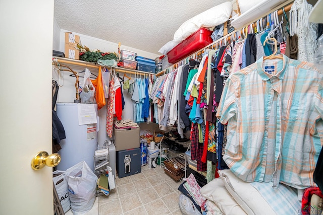 walk in closet featuring electric water heater