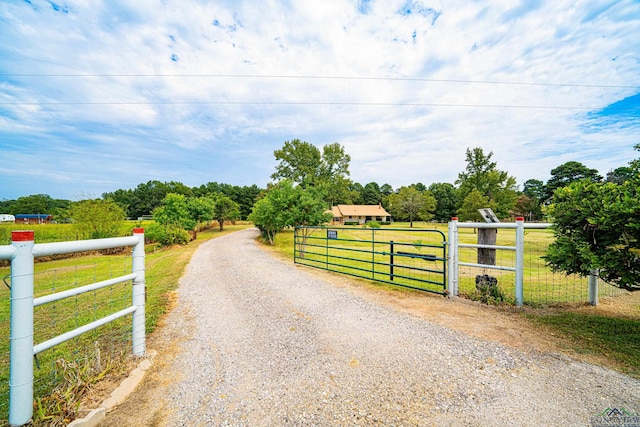 view of gate featuring a rural view