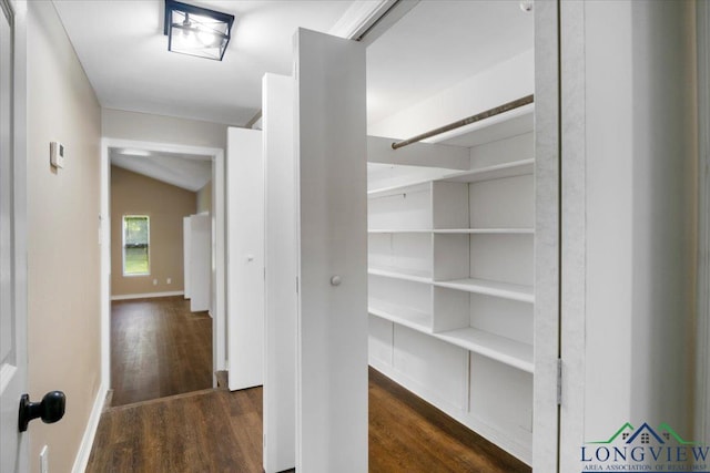 1012 Premier Rd, Longview, TX 75604 - corridor featuring wood finished floors, baseboards, and lofted ceiling