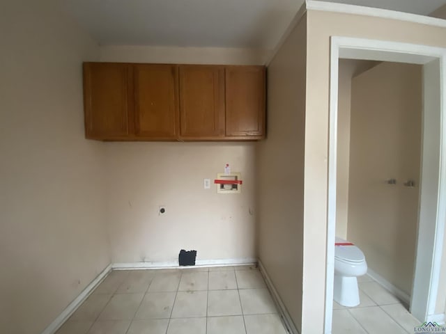 laundry room featuring washer hookup, light tile patterned floors, and hookup for an electric dryer