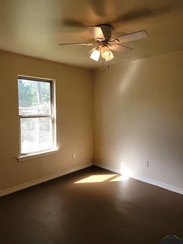 unfurnished room with ceiling fan