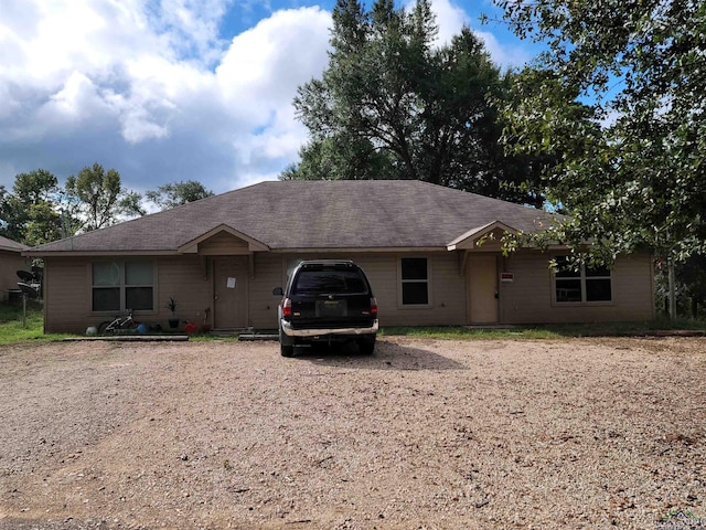 ranch-style home featuring a garage