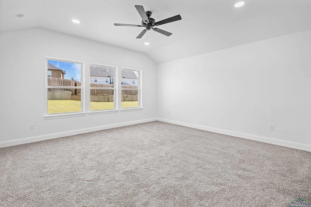 unfurnished room with ceiling fan, carpet, and lofted ceiling