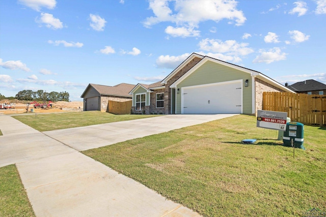 ranch-style home with a front lawn and a garage