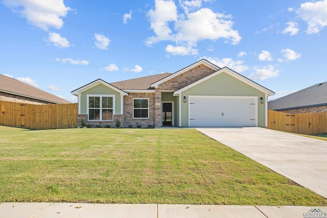 view of front of property featuring a front lawn and a garage