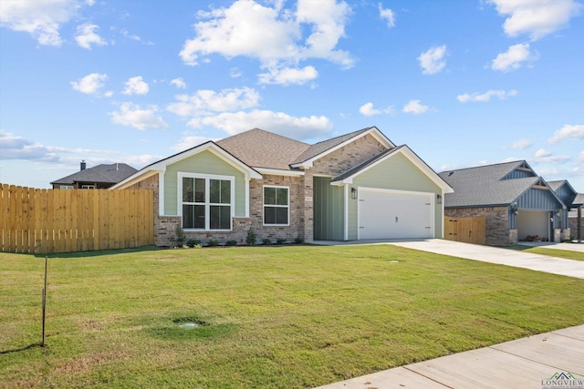 view of front of house with a garage and a front yard