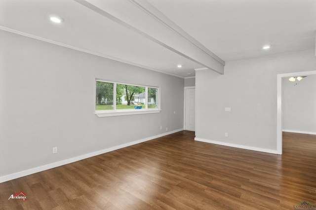 unfurnished room featuring beam ceiling, dark wood-type flooring, and ornamental molding