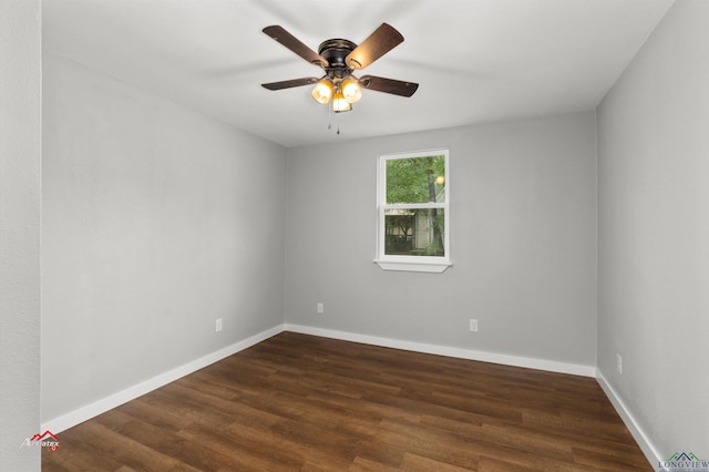 empty room with dark hardwood / wood-style floors and ceiling fan