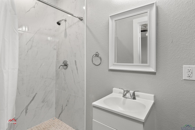 bathroom with vanity and curtained shower