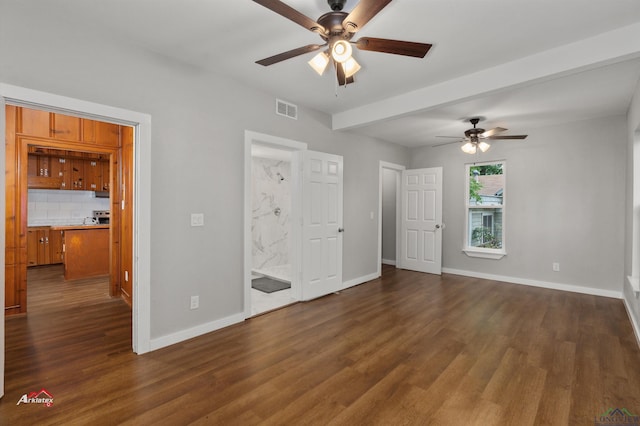 unfurnished bedroom featuring ensuite bathroom, ceiling fan, and dark hardwood / wood-style flooring