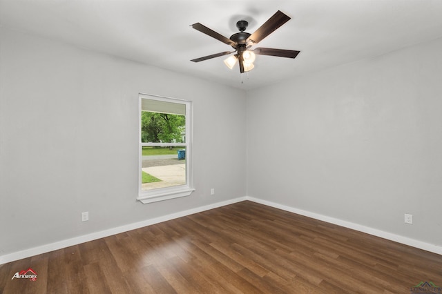 spare room featuring ceiling fan and dark hardwood / wood-style flooring