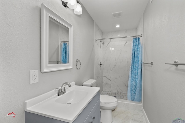 bathroom featuring vanity, toilet, and curtained shower