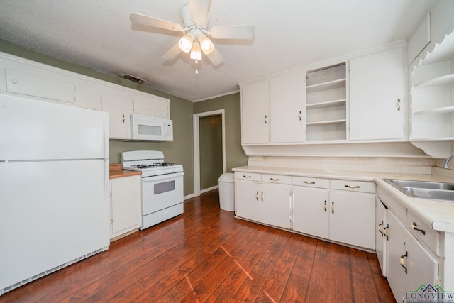 kitchen featuring white cabinets, white appliances, dark hardwood / wood-style floors, and sink