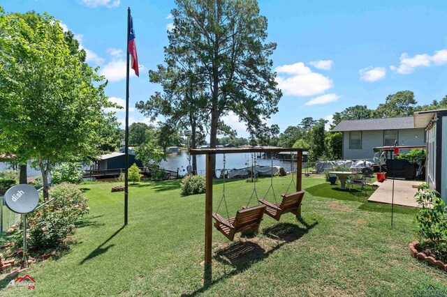 589 County Road 183, Carthage, TX 75633 - view of green lawn with a water view