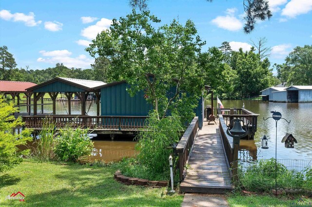 589 County Road 183, Carthage, TX 75633 - dock area featuring a water view and a yard