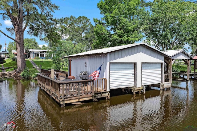 589 County Road 183, Carthage, TX 75633 - dock with a water view and boat lift